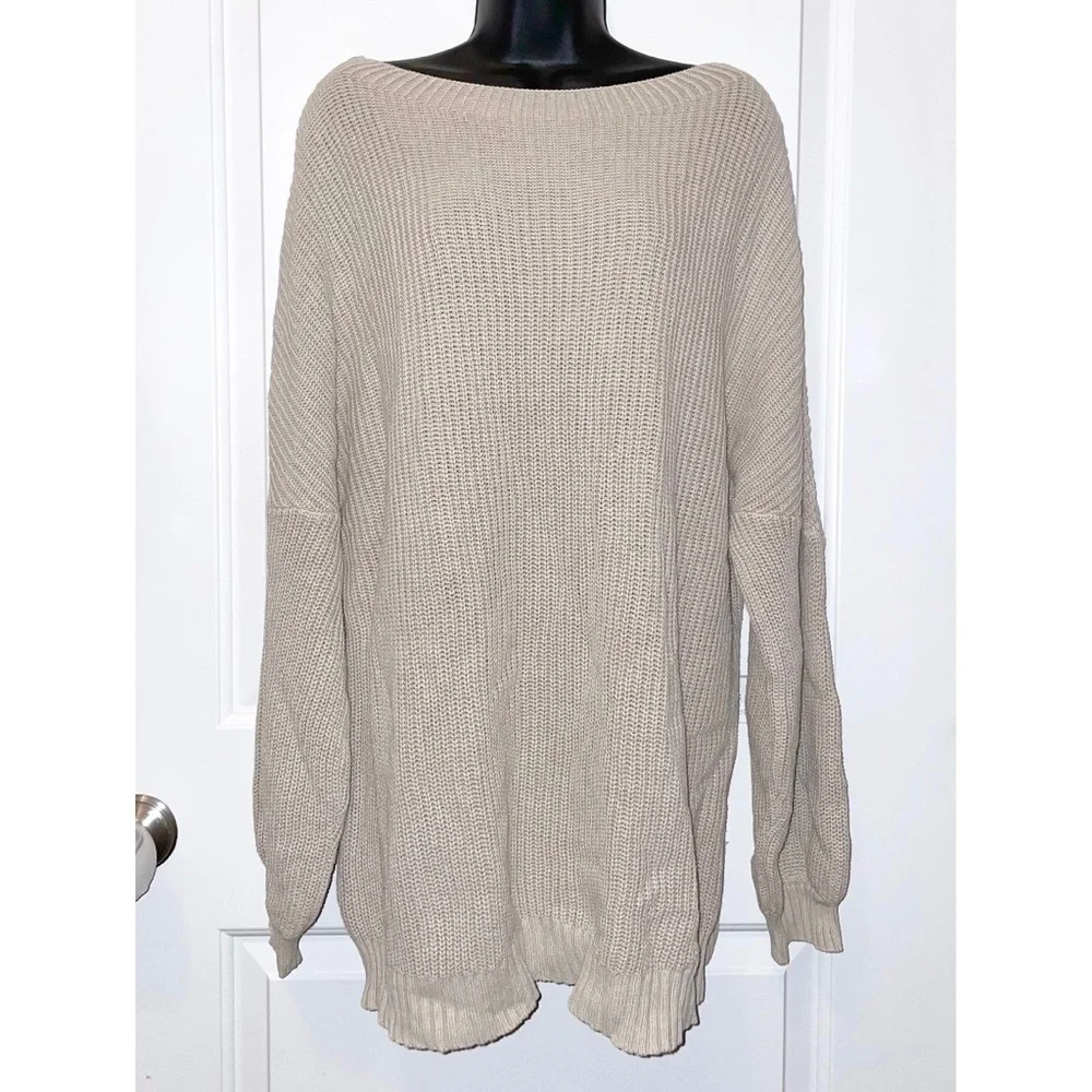 Mazik textured knit sweater features a soft beige/ivory color and a relaxed fit